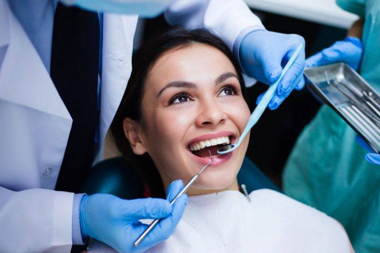dentist in worcester | dental cleaning with patient