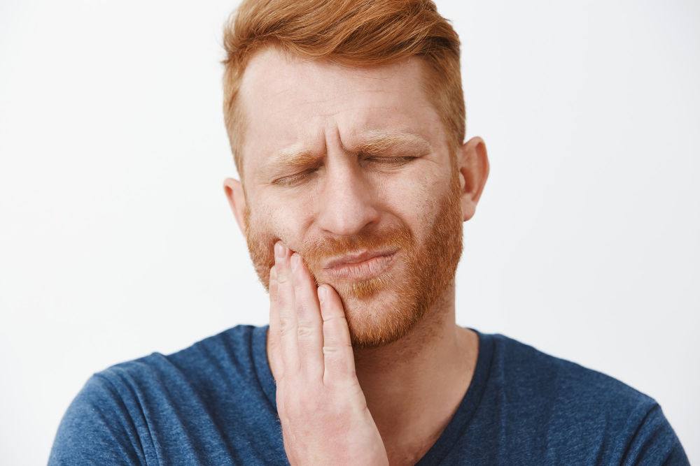 Worcester dental Emergency | Man holding Jaw